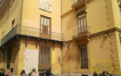Historic building facade in Valencia, part of the Holy Grail self-guided city exploration game.