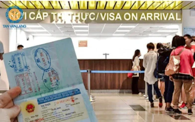 Visa on arrival counter in Hanoi with a person holding a stamped passport.
