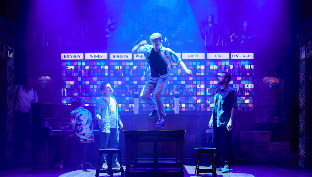 The Choir of Man performance with a dancer on a table, Sydney.