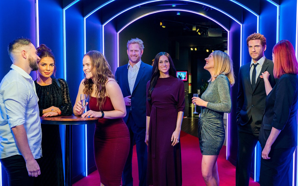 Visitors interacting with wax figures at Madame Tussauds Sydney.