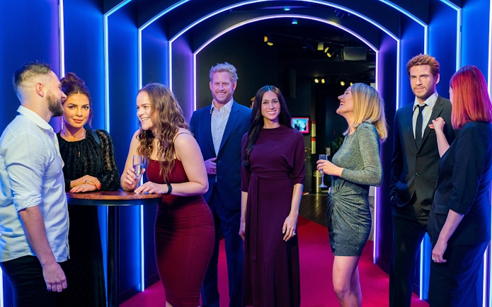 Visitors interacting with wax figures at Madame Tussauds Sydney.