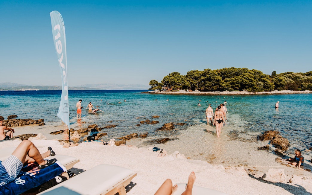Guests swimming and snorkeling at Blue Lagoon during Solta & Trogir Speedboat Tour.