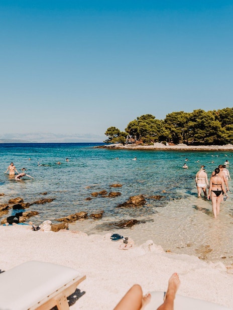 Guests swimming and snorkeling at Blue Lagoon during Solta & Trogir Speedboat Tour.
