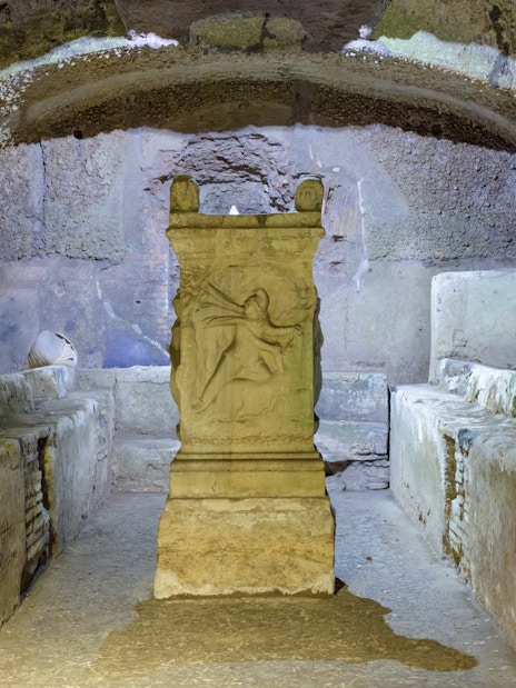 Mithraeum altar under Basilica of Saint Clement, Rome, Italy, with ancient stone benches.