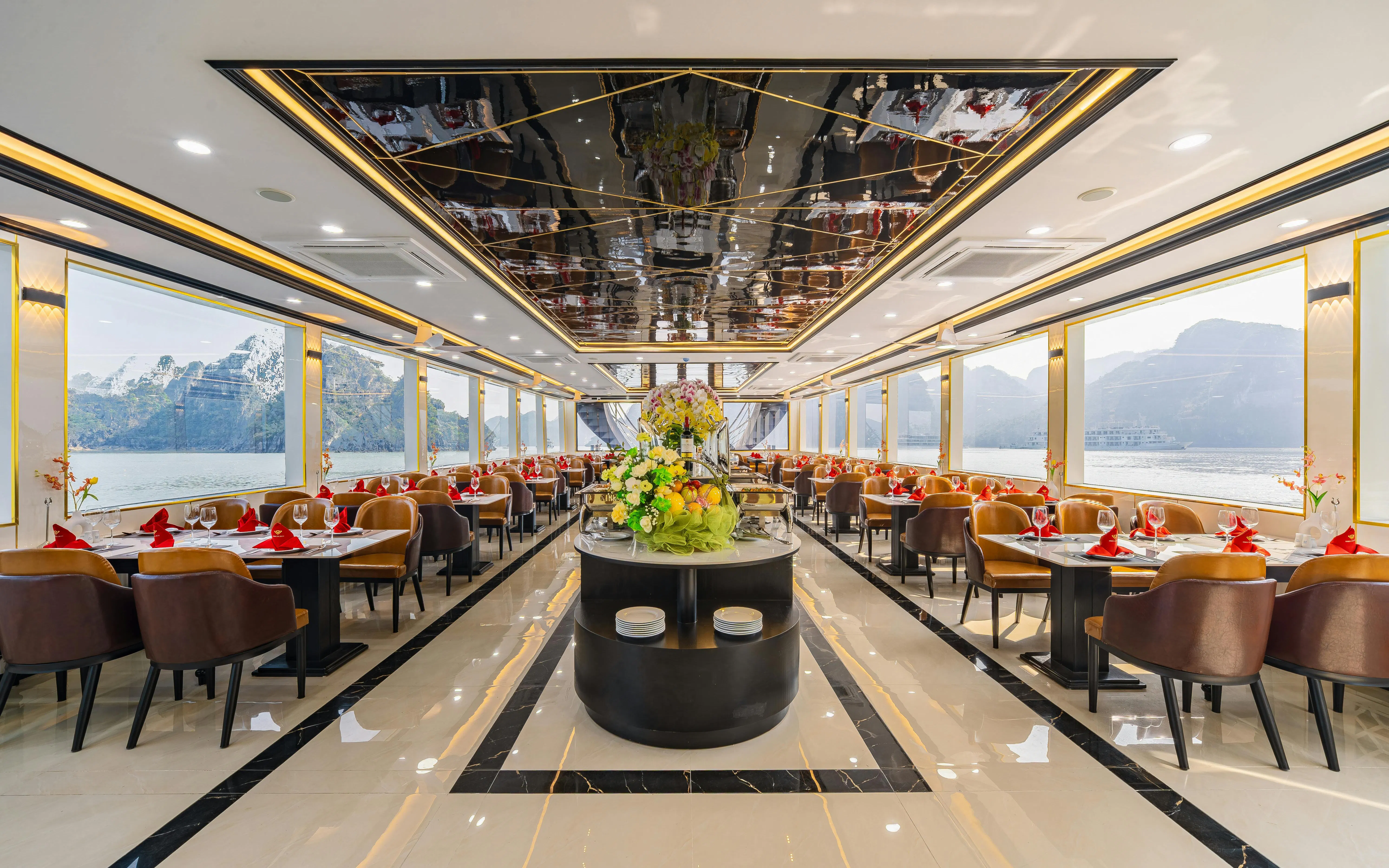 Luxury dining area on Ha Long Bay cruise with panoramic views.