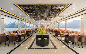 Luxury dining area on Ha Long Bay cruise with panoramic views.