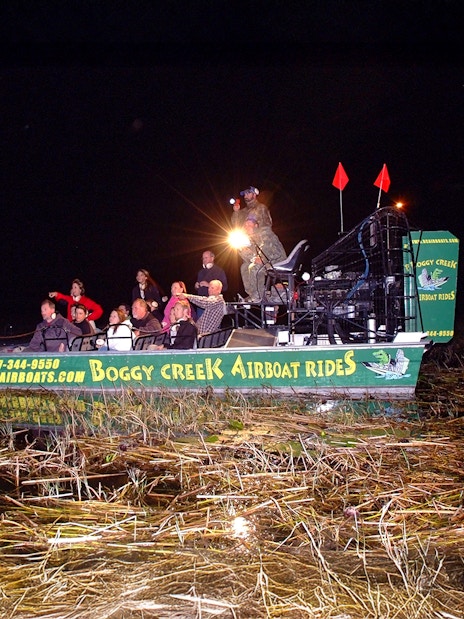 Group on an airboat during a night tour at Boggy Creek in Orlando.