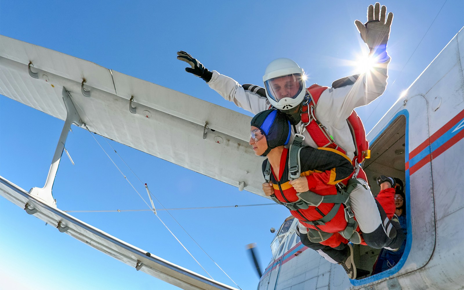 Tandem divers jumping off a plane, Dubai Skydiving