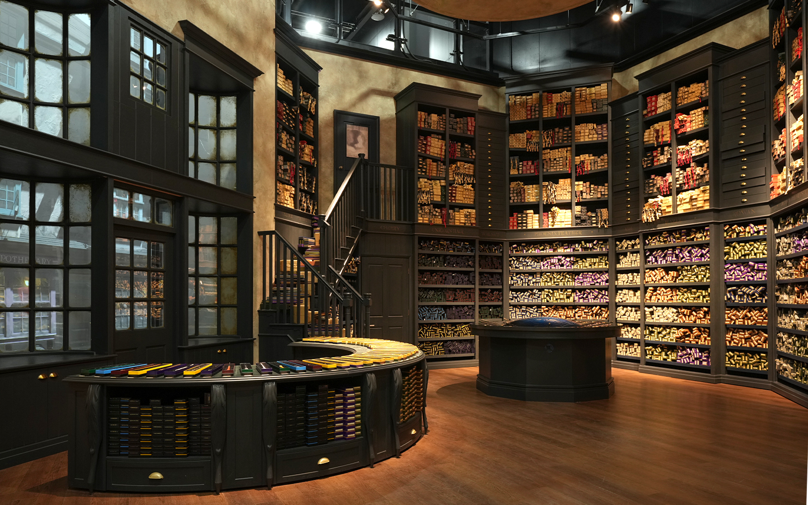 Wand shop interior at Warner Bros. Studio Tour Tokyo, showcasing shelves filled with wand boxes.
