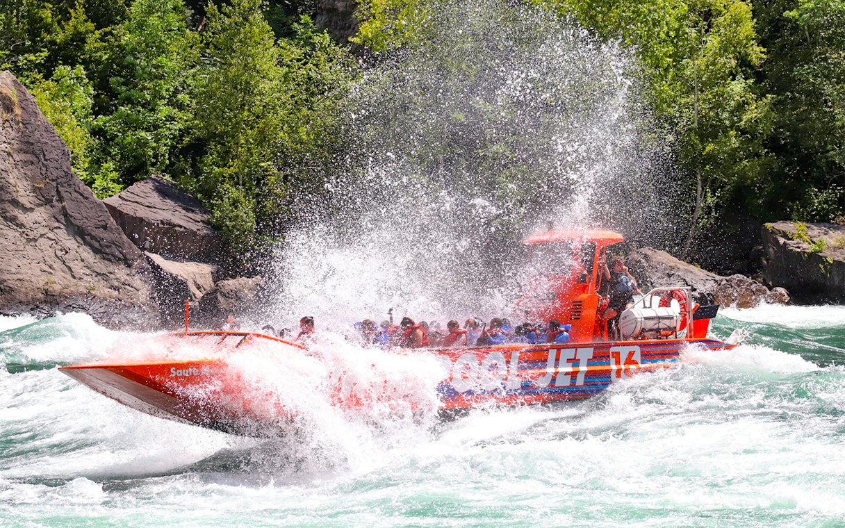 Guests enjoying a thrilling Whirlpool Jet Boat ride in the Niagara Gorge, Canada.