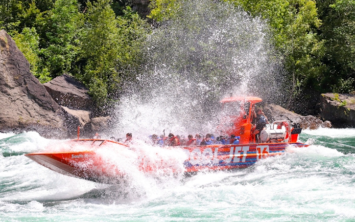 Guests enjoying a thrilling Whirlpool Jet Boat ride in the Niagara Gorge, Canada.