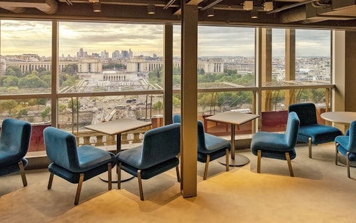 Lounge seating with city view at Madame Brasserie Eiffel Tower Restaurant, Paris.