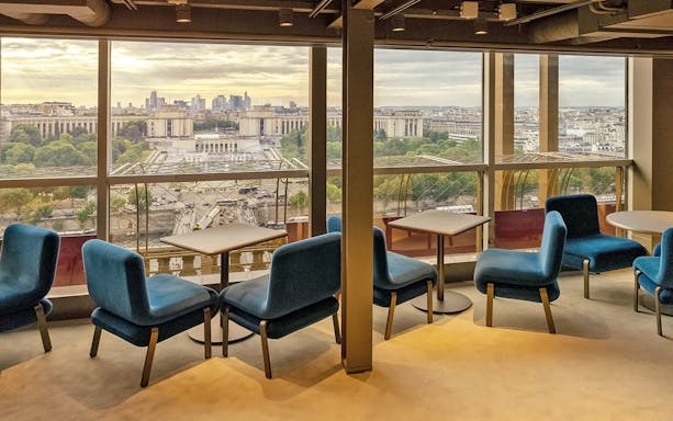 Lounge seating with city view at Madame Brasserie Eiffel Tower Restaurant, Paris.