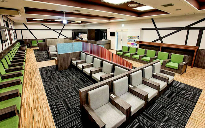Waiting area seating at Narita International Airport Terminal 1 lounge.