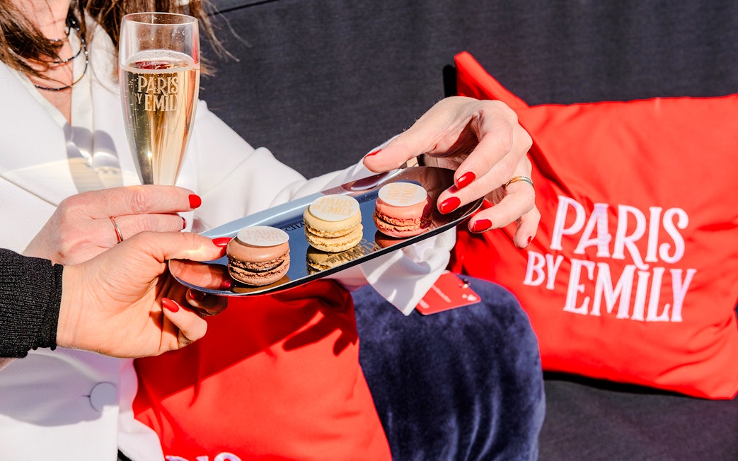 Macaroons and champagne on The Official Emily in Paris Champagne Seine Cruise.