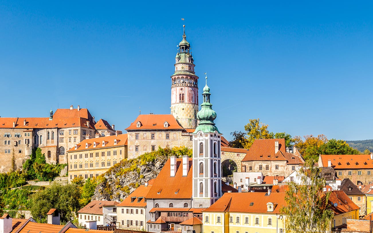 Castle of Cesky Krumlov with colorful buildings and tower in South Bohemia.