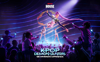 Kpop Demon Hunters show at Netflix House Philadelphia with animated performers on stage.