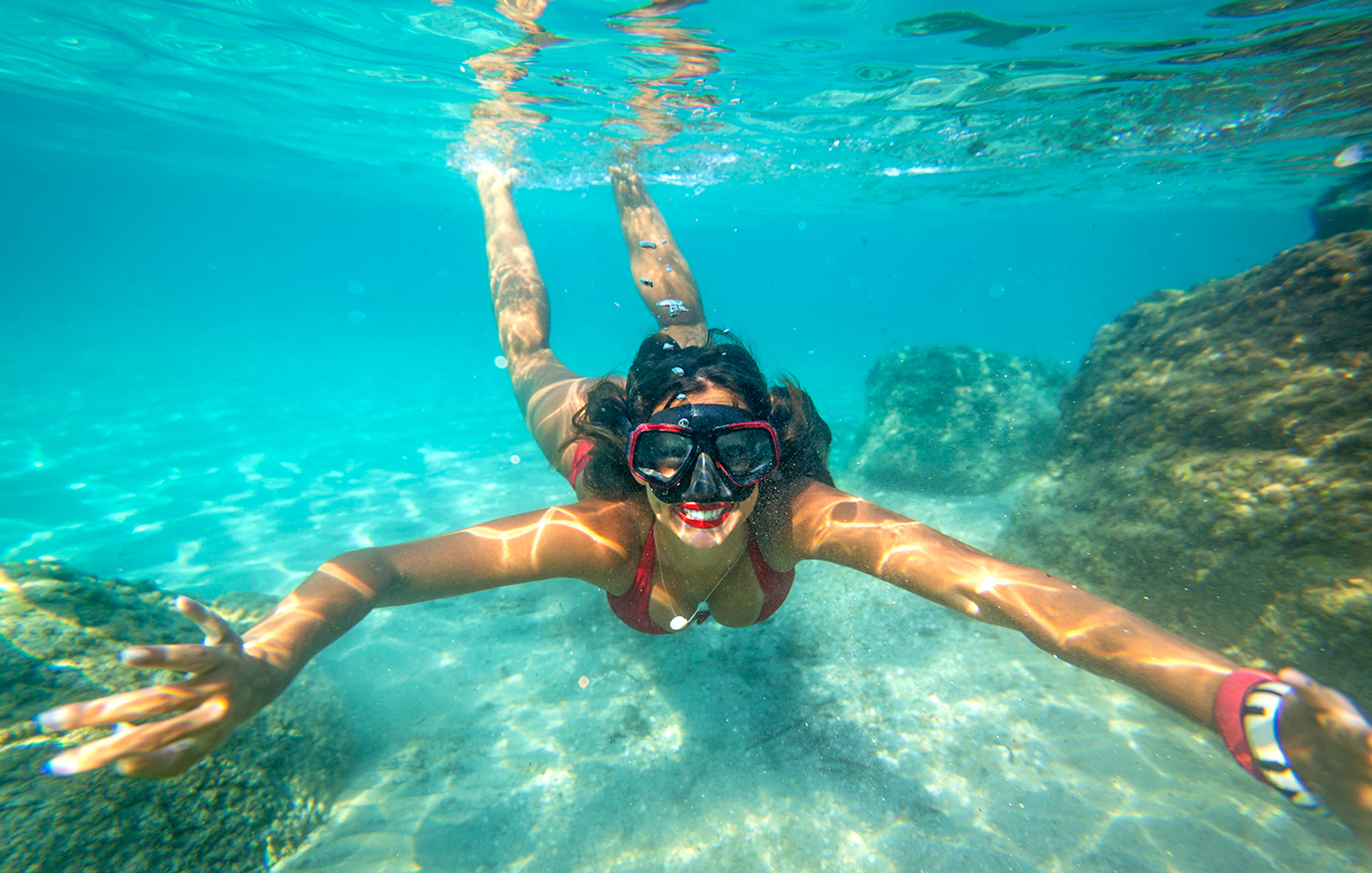 Snorkeler exploring underwater rocks in Dubrovnik.