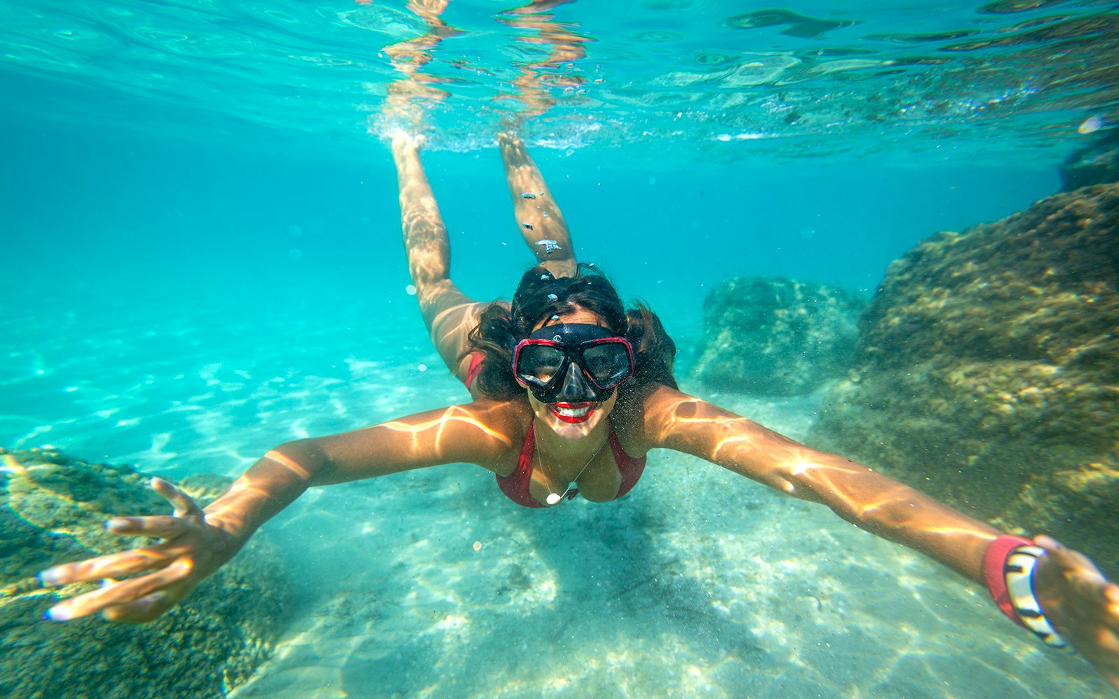 Snorkeler exploring underwater rocks in Dubrovnik.