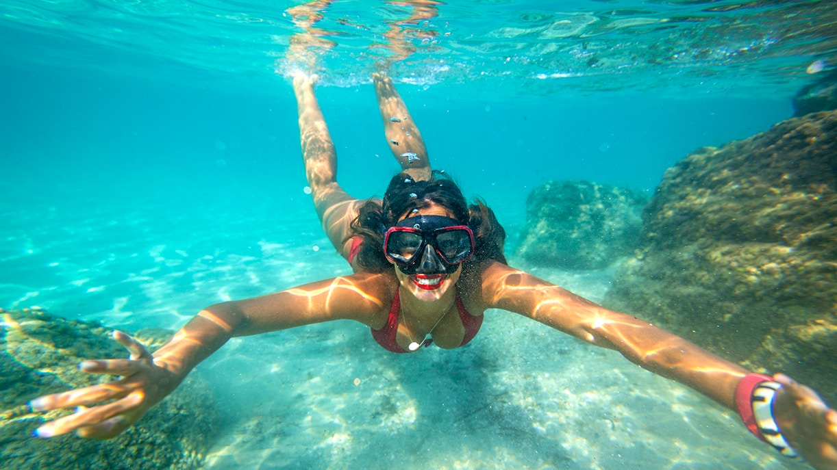 Snorkeler exploring underwater rocks in Dubrovnik.