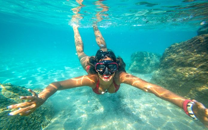 Snorkeler exploring underwater rocks in Dubrovnik.