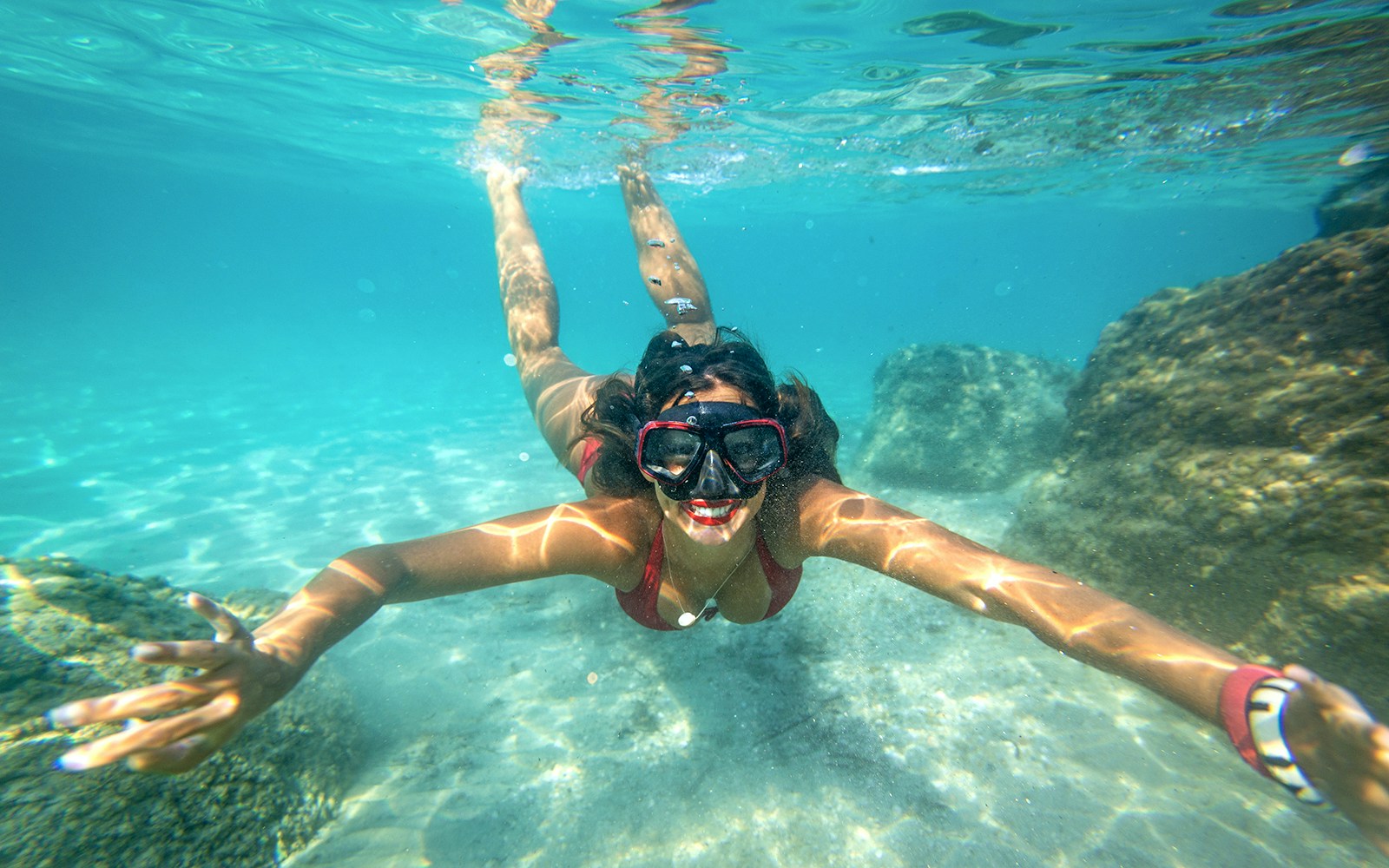 Snorkeler exploring underwater rocks in Dubrovnik.