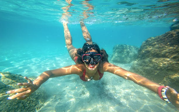 Snorkeler exploring underwater rocks in Dubrovnik.