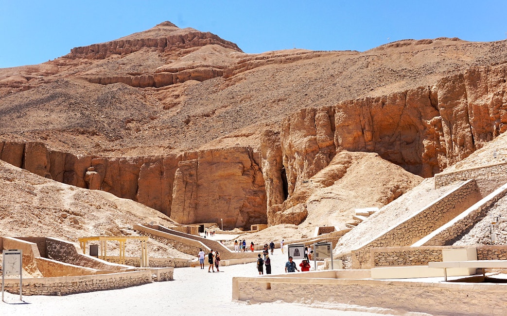 Tourists exploring the ancient tombs in the Valley of the Kings, Egypt.