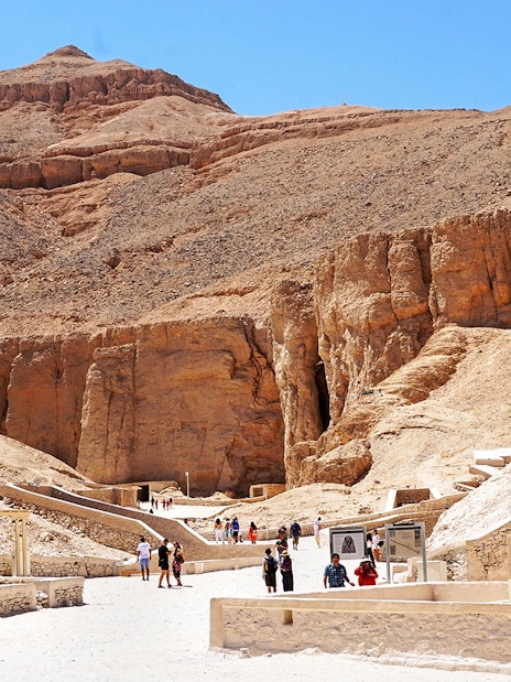 Tourists exploring the ancient tombs in the Valley of the Kings, Egypt.