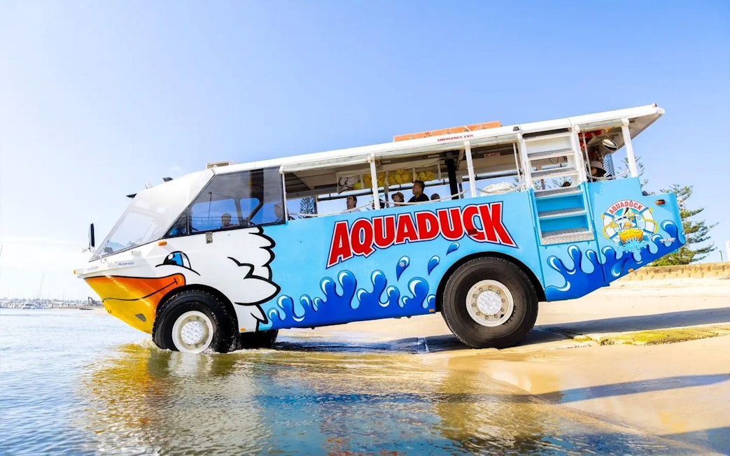 Aquaduck amphibious vehicle entering water on Sunshine Coast city tour and river cruise.