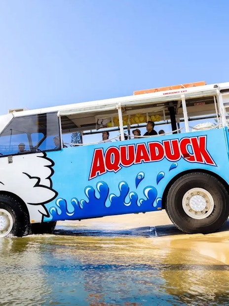 Aquaduck amphibious vehicle entering water on Sunshine Coast city tour and river cruise.