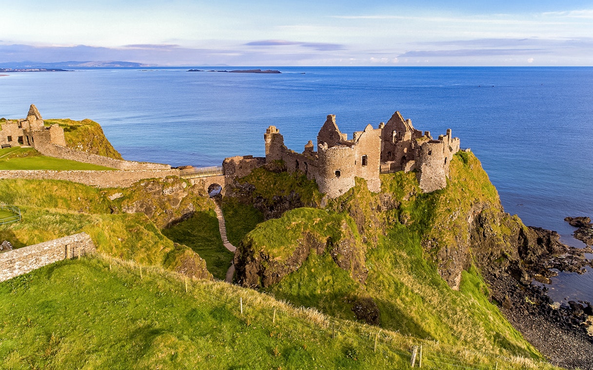 Dunluce Castle ruins on a cliff overlooking the sea, Northern Ireland, Game of Thrones tour location.