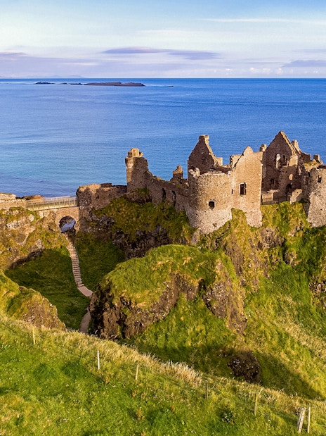 Dunluce Castle ruins on a cliff overlooking the sea, Northern Ireland, Game of Thrones tour location.
