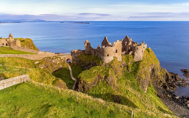 Dunluce Castle ruins on a cliff overlooking the sea, Northern Ireland, Game of Thrones tour location.