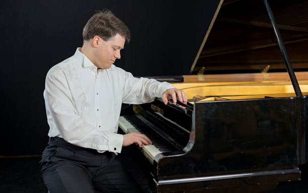 Pianist performing at Chopin Point in Warsaw.