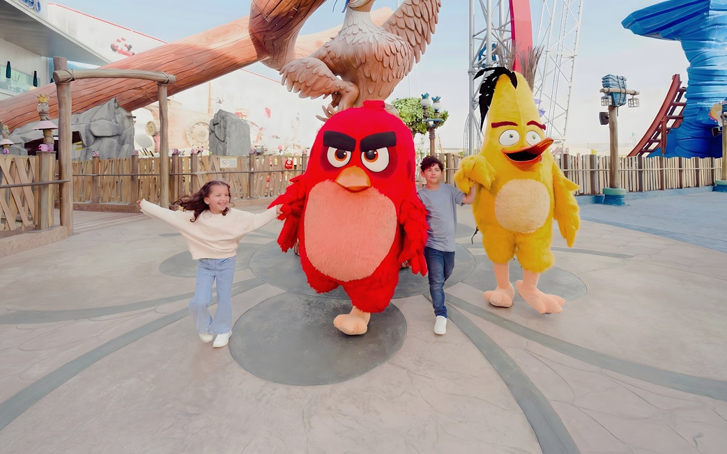 Children with Angry Birds mascots at Angry Birds World Theme Park.