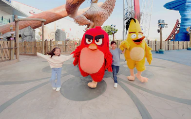 Children with Angry Birds mascots at Angry Birds World Theme Park.