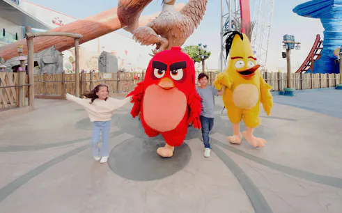 Children with Angry Birds mascots at Angry Birds World Theme Park.