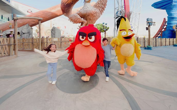 Children with Angry Birds mascots at Angry Birds World Theme Park.