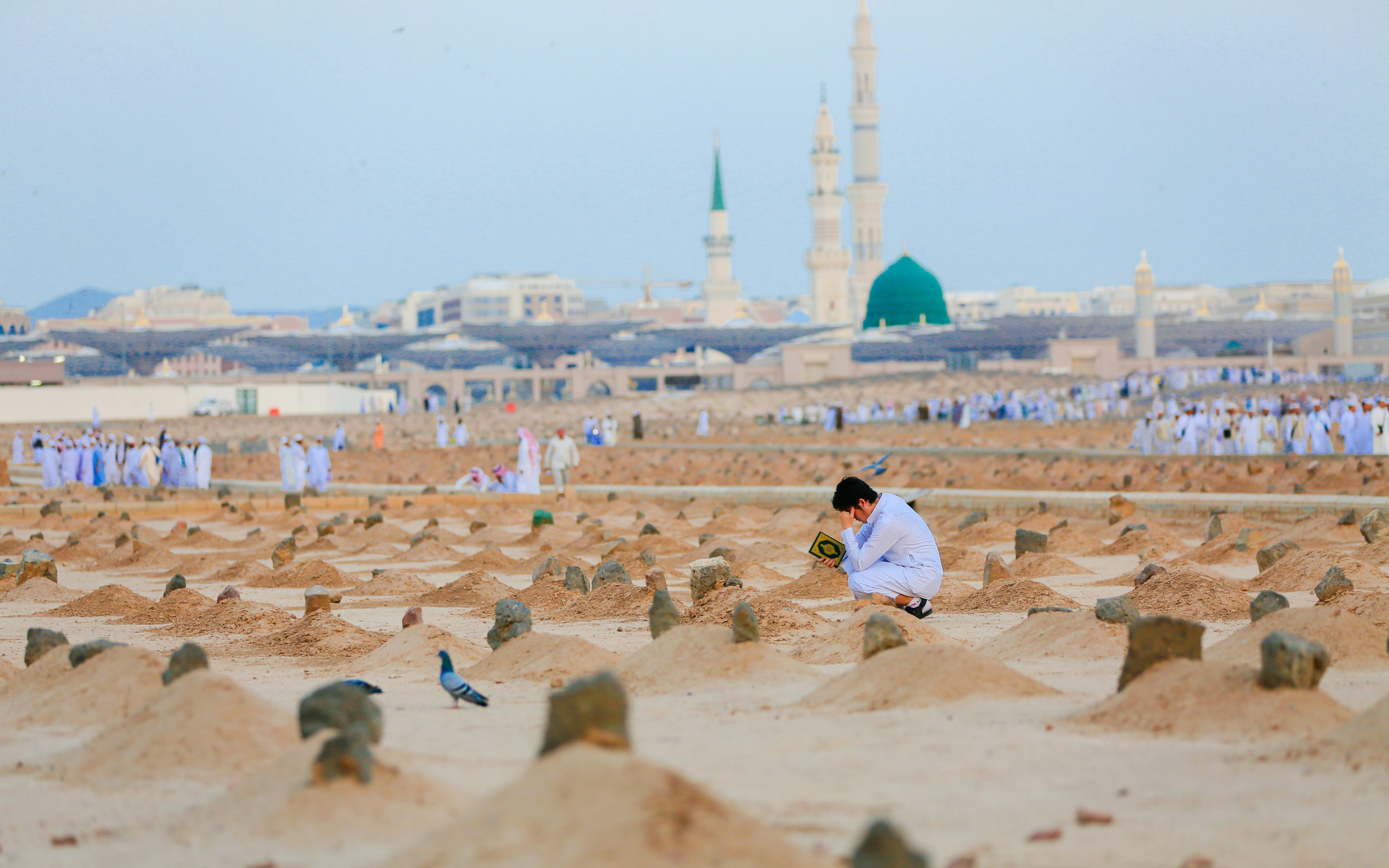 Baqee' Cemetery with worshippers near Masjid Nabawi, Al Madinah.