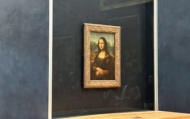 Mona Lisa painting displayed at the Louvre Museum, Paris.