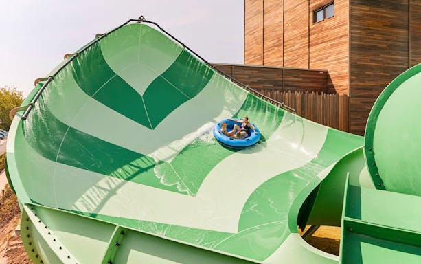 Tourists on a water ride at Bellewaerde Aquapark.