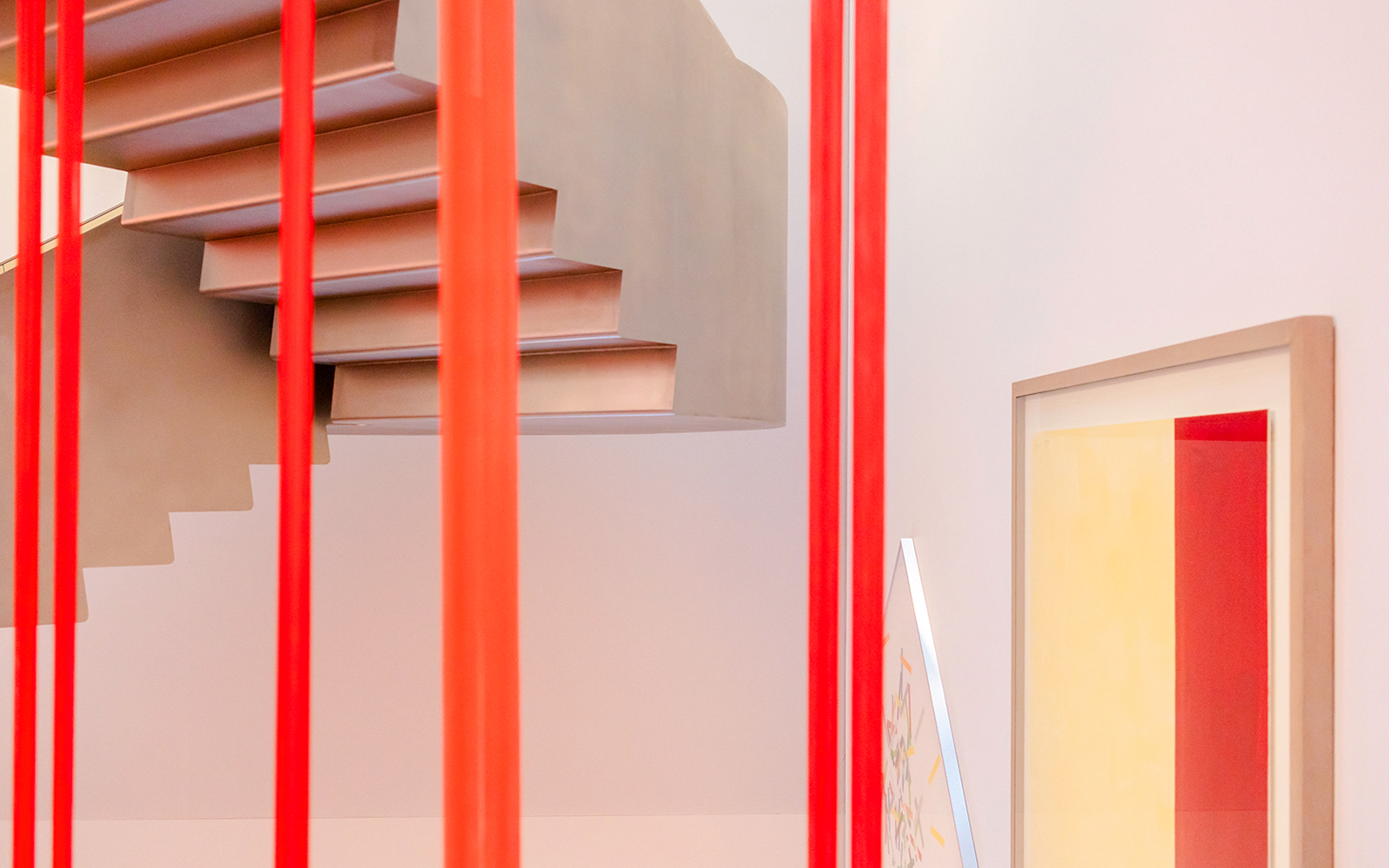 Exhibition view with red vertical bars and staircase at Heidi Horten Collection Vienna.