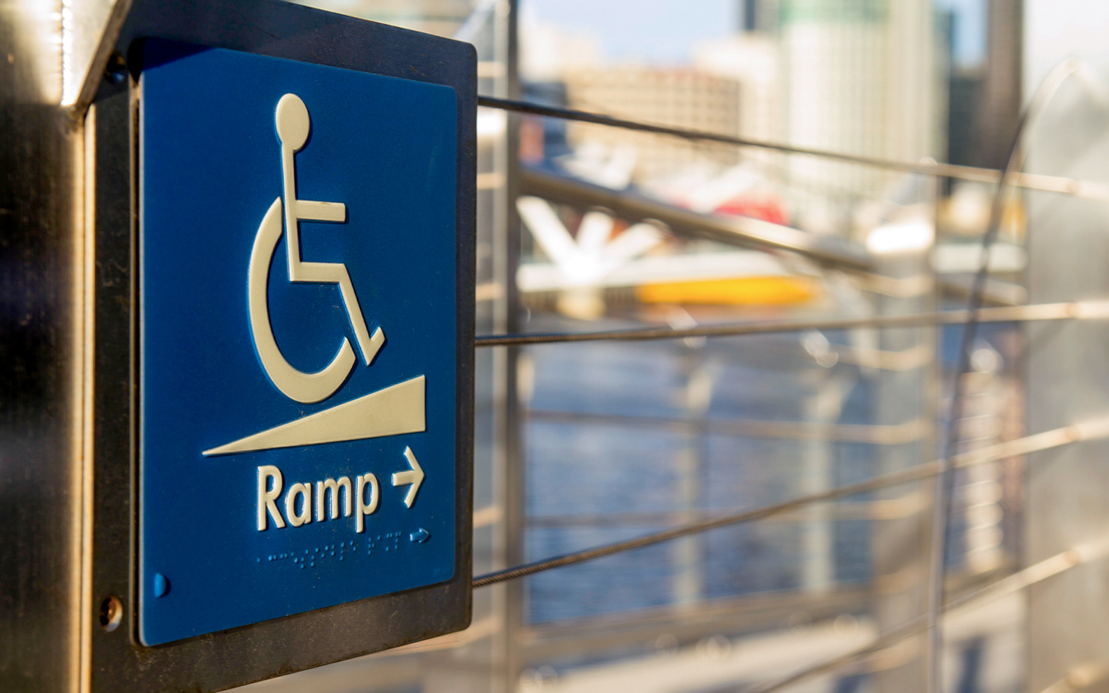 Wheelchair ramp signage at Seine river, Paris ensuring accessibility for all visitors.