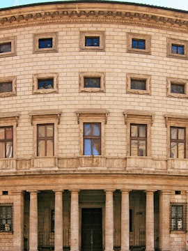 Palazzo Massimo facade with columns and arched windows in Rome, Italy.