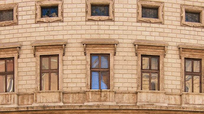 Palazzo Massimo facade with columns and arched windows in Rome, Italy.