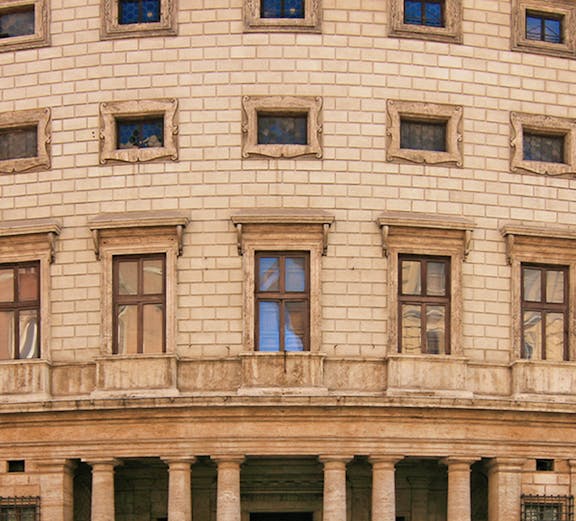 Palazzo Massimo facade with columns and arched windows in Rome, Italy.