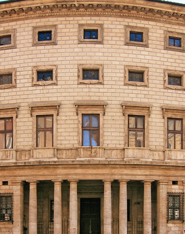 Palazzo Massimo facade with columns and arched windows in Rome, Italy.