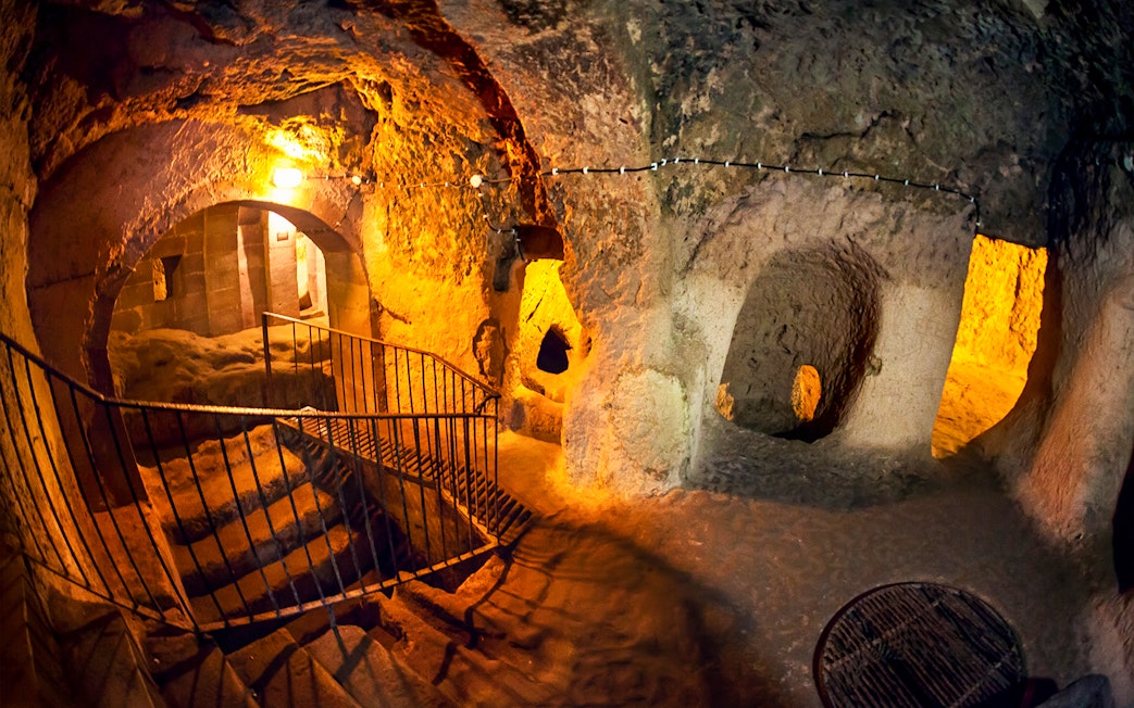 Maze of caves with stairs inside Derinkuyu Underground City, Turkey.