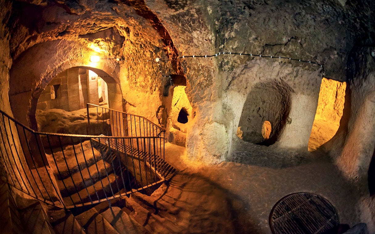 Maze of caves with stairs inside Derinkuyu Underground City, Turkey.